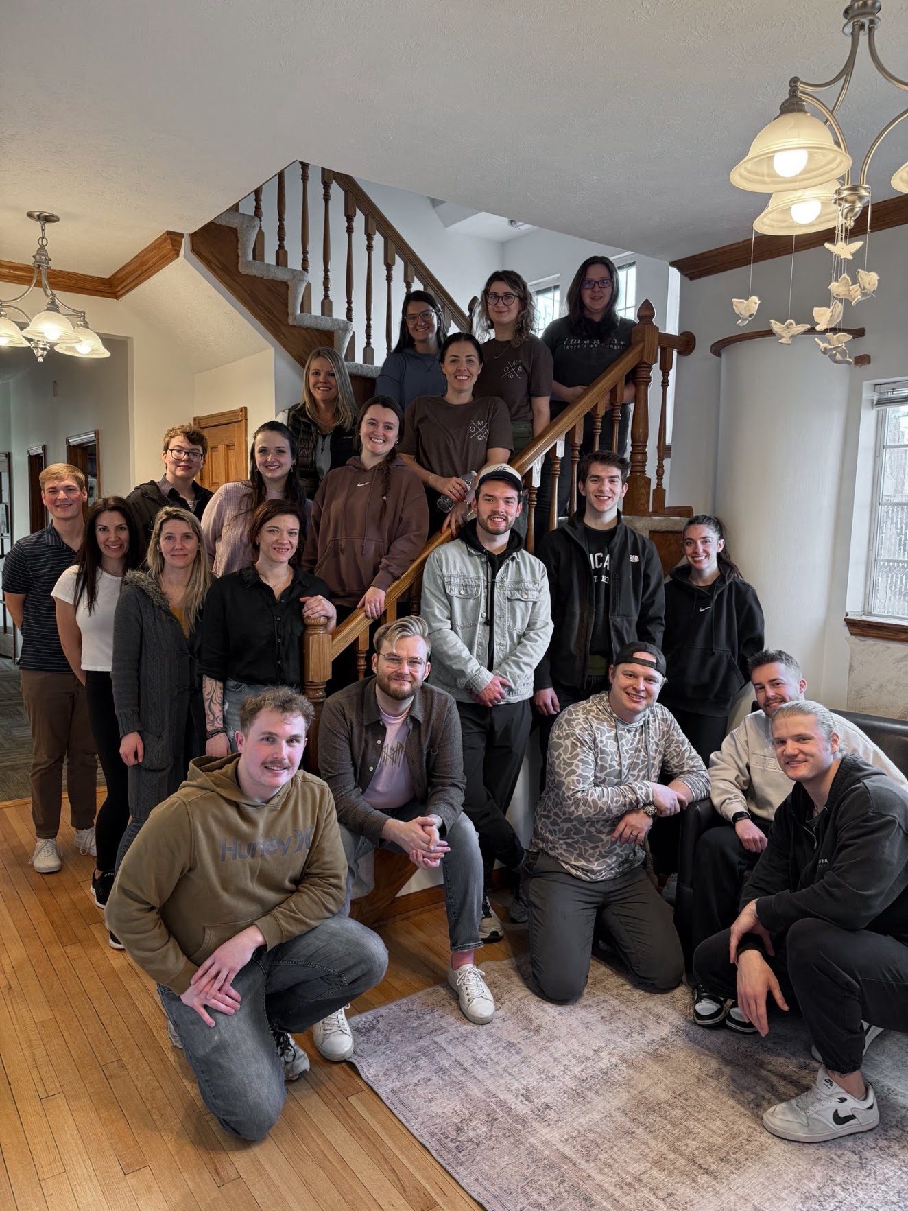 Briley Team agents gathered on a staircase